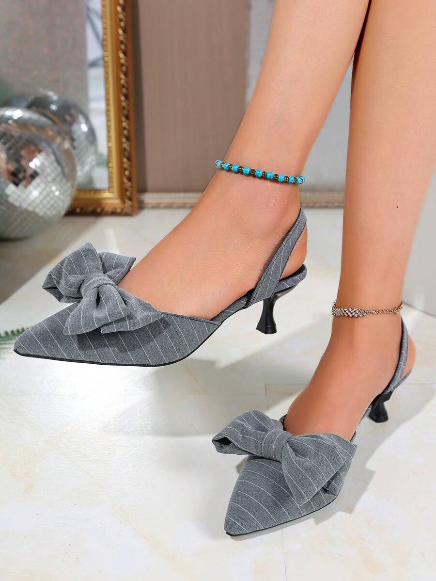 A Pair Of Striped Bow-Tipped High-Heeled Sandals, Girls' Spring And Summer Temperament, Light-Mouth Thin-Heeled Bag-Head Shoes, Empty Sandals Behind The Bag-Head.