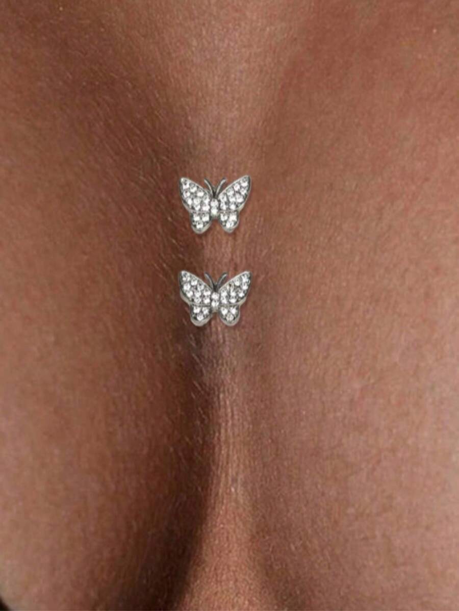 1 par de adhesivos con diseño de mariposa de moda en color plateado para el escote