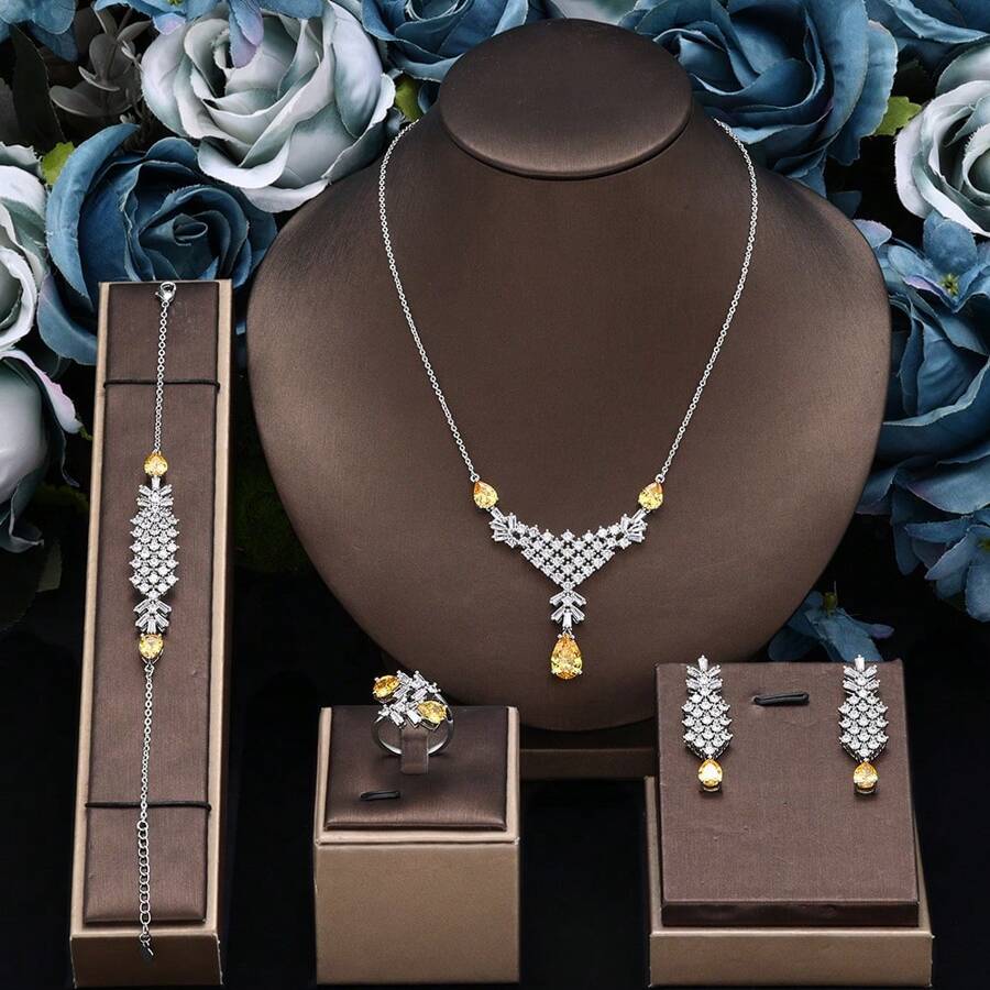 Ensemble de bijoux en zirconium goutte d'eau pour femmes. Comprend un collier, des boucles d'oreilles, un bracelet et une bague. 4 pièces de bijoux de mariée