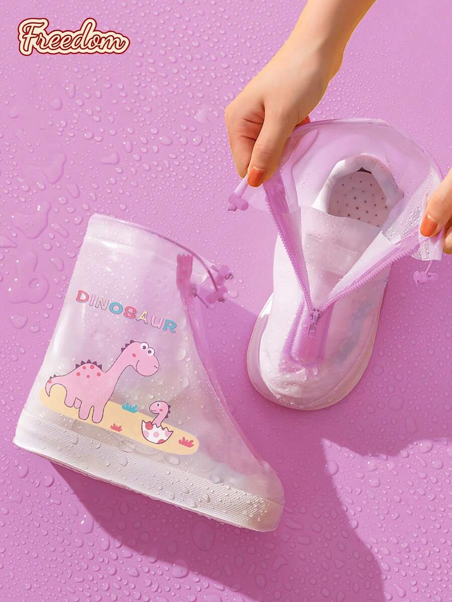 Freedom 1 par de cubiertas de botas de lluvia de PVC para niños, con diseño de dinosaurio de dibujos animados, cubrecalzado impermeable con cordón frontal, cubierta de zapatos reutilizable antideslizante para exteriores, para la escuela, oficina, hogar, viajes, útiles escolares