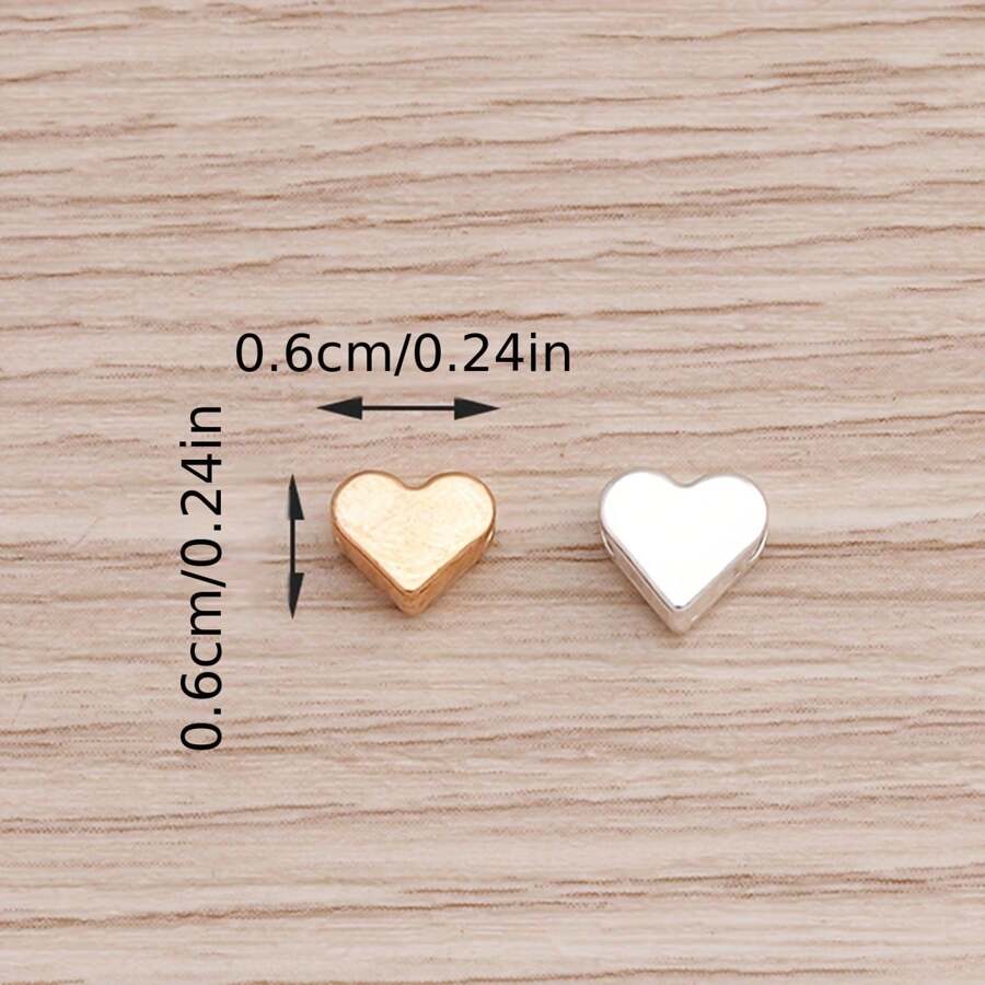 30 piezas de pequeñas cuentas con forma de corazón en color plata y oro, adecuadas para hacer manualidades de joyería, collares y accesorios de pulseras