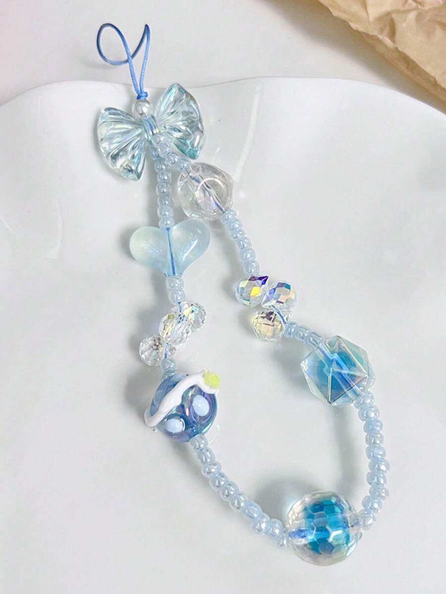 1 pieza Cordón para teléfono móvil con forma de corazón con lazo azul y cuentas hecho a mano, colgante DIY para primavera y verano, cadena para cámara CCD