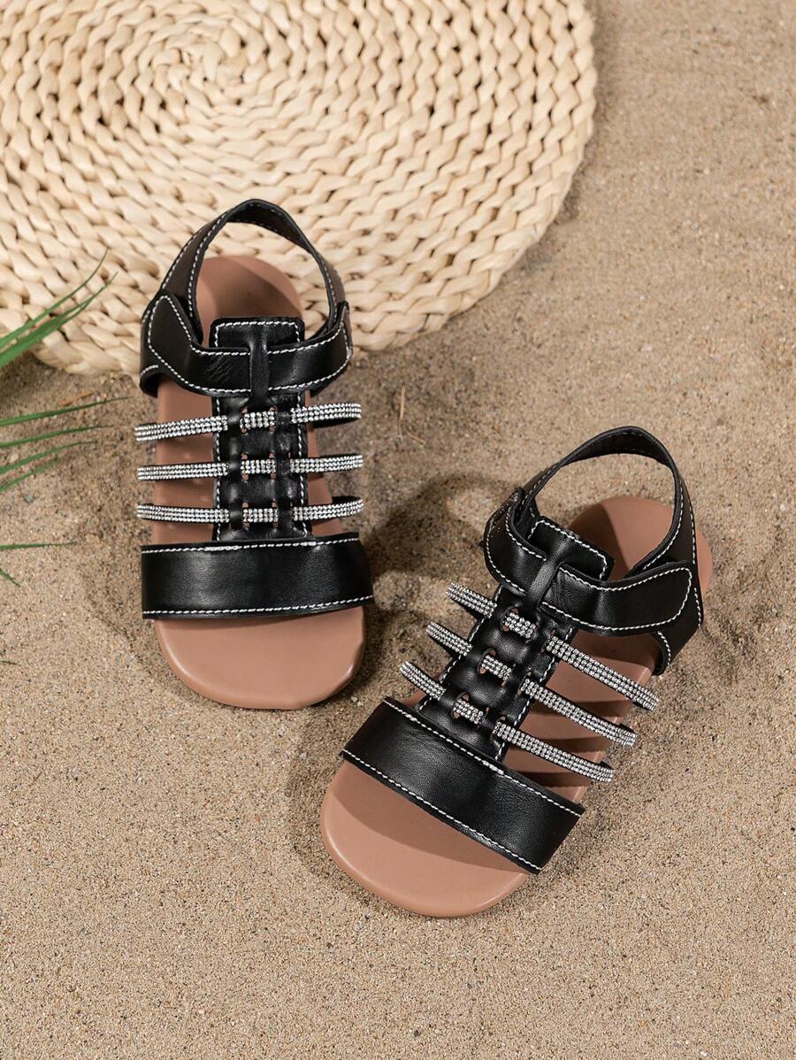 Un par de sandalias planas de moda para niños, nuevas sandalias de playa para niños 2025, sandalias de estilo bohemio, sandalias brillantes con diamantes y coloridas, adecuadas para vacaciones al aire libre, piscina, fiestas y uso escolar