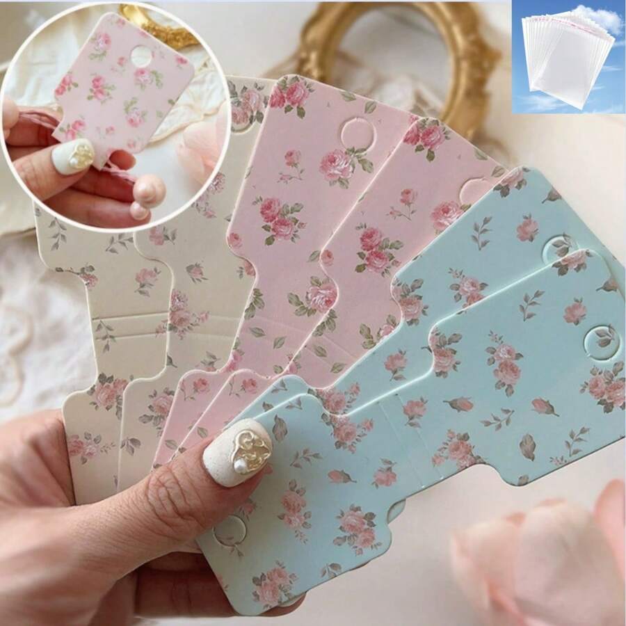 50/100 pezzi Cartoncini per esposizione di braccialetti, collane e fasce per capelli - Disegni floreali eleganti rosa e bianchi, cartellini per artigianato fai-da-te e forniture per piccole imprese, etichette per prezzi al dettaglio | Etichette dai colori attenuati | Stampa di alta qualità