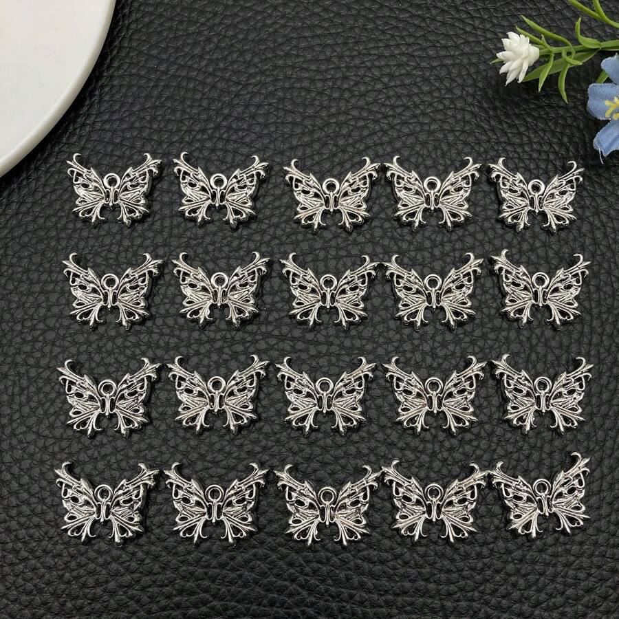 10/20/30 piezas Colgante de mariposa hueco de aleación de plata antigua, lindo colgante de insecto animal para hacer pulseras, collares, aretes, manualidades y accesorios de joyería, 25x19mm