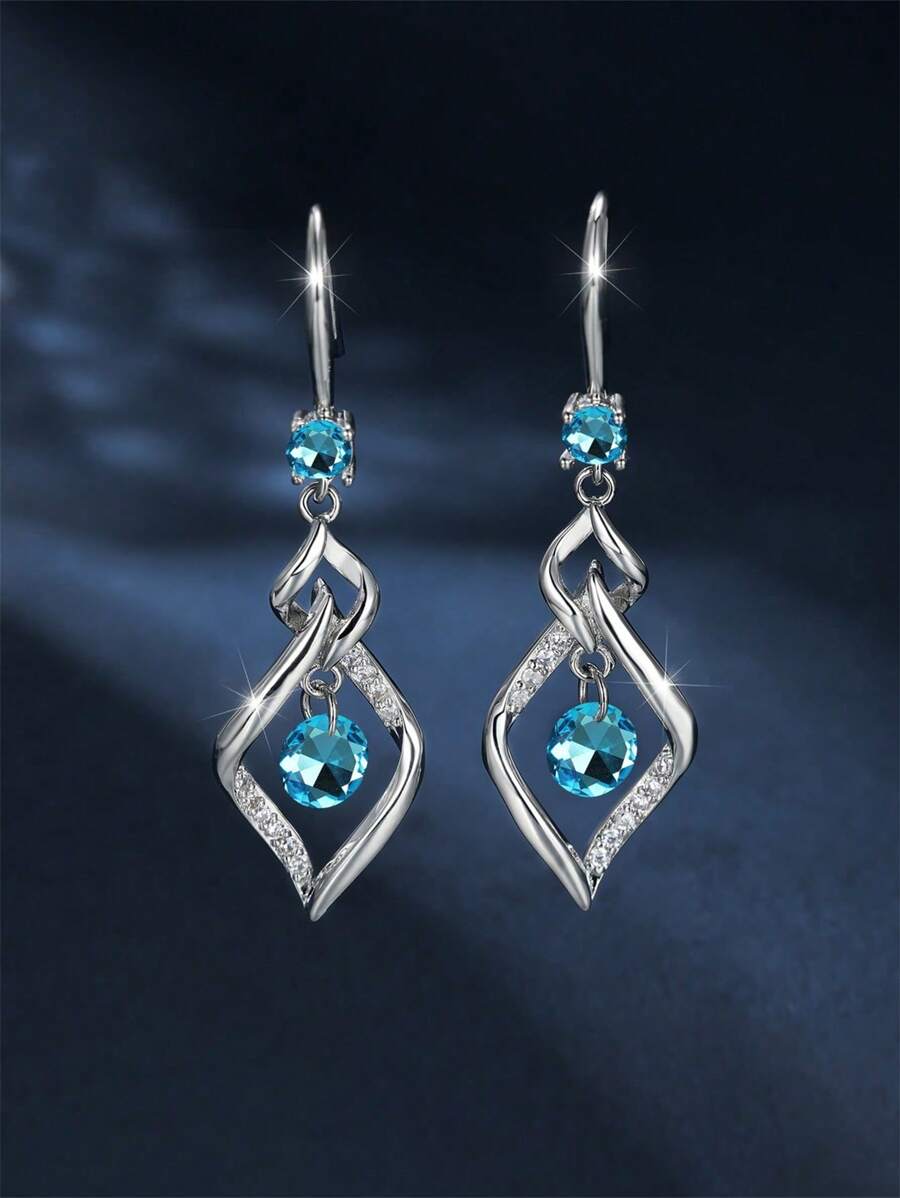 1 paire de boucles d'oreilles élégantes et à la mode avec zircone bleue et gland tourbillonnant. Convient pour le port quotidien, les fêtes et les voyages des femmes. Cadeau de bijoux pour la petite amie, à porter en rendez-vous