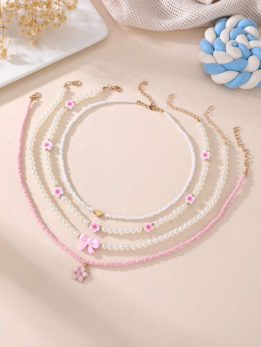 Set de 4 collares con mariposas y flores de perlas y cuentas para niñas