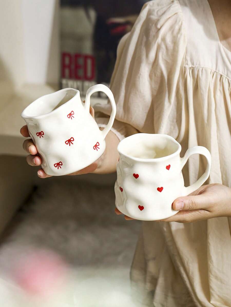 1pc INS Style Large Capacity Ceramic Mug With Bowknot & Heart Design, Handcrafted Asymmetrical Coffee Cup, Suitable For Home Breakfast, Milk, Oatmeal, Garden Afternoon Tea, Latte Art, Juice & Couple Water Cup