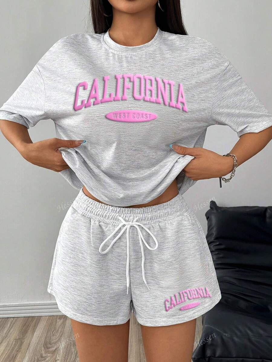 Set de 2 piezas de camiseta de manga corta de cuello redondo holgada con estampado de letras y shorts para mujer, conjunto estampado de estilo casual para uso diario y vacaciones