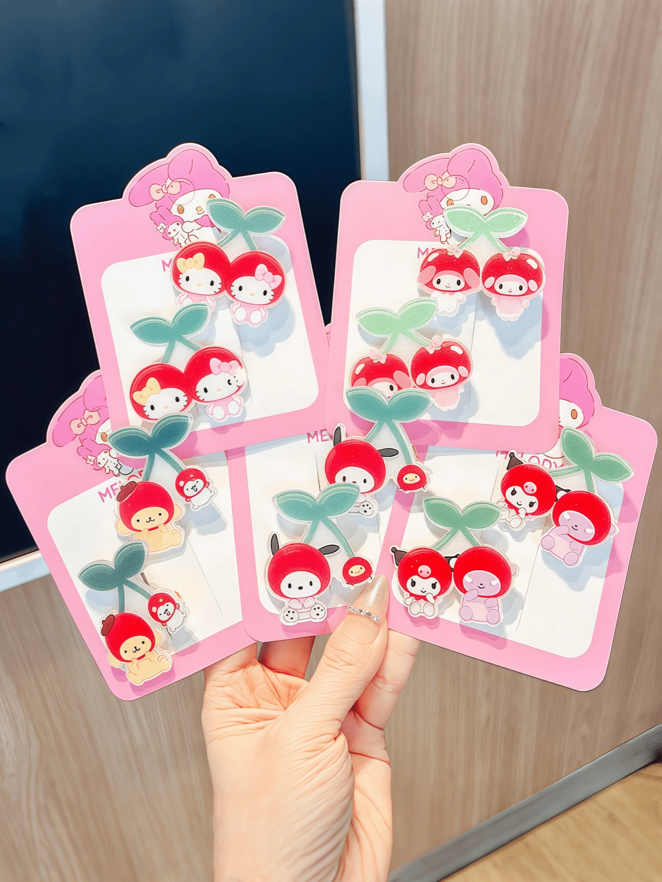 Sanrio Sanrio. 2 - Piece Hair Clip Set Featuring Hello Kitty, My Melody, And Kuromi. These Hair Clips Are Designed With Cherries Paired With Cute Cartoon Characters. (Packaged In Cardboard.) They Make Thoughtful Gifts For Children And Young Girls.