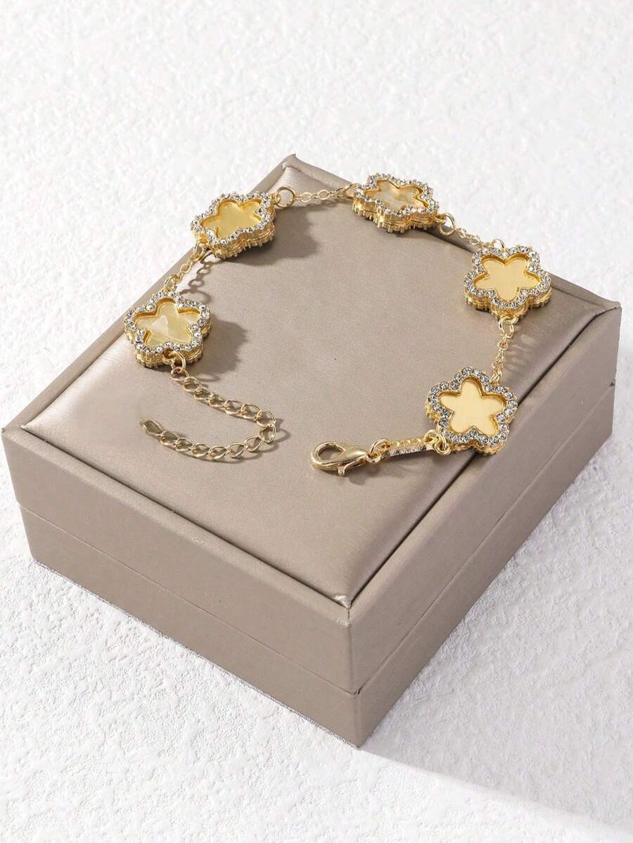 1 pièce Bracelet doré orné de strass en forme de trèfle pour femmes, mode et élégant (sans boîte-cadeau)