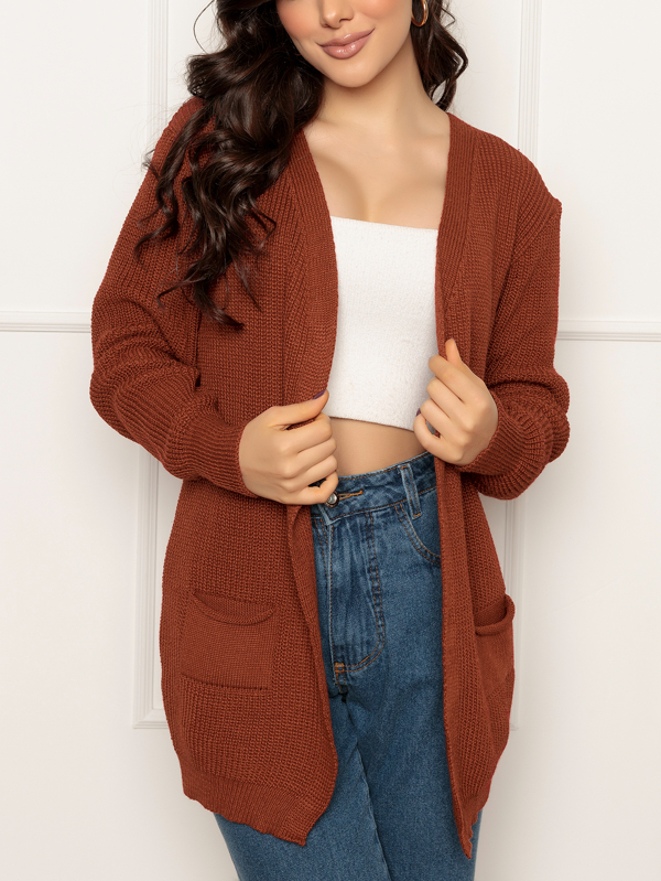 Casaco tricot manga longa com dois bolsos