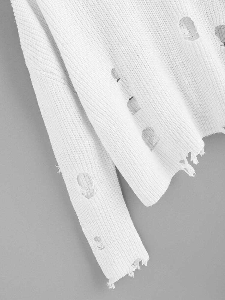 Stickad tröja med slitna detaljer Stickad tröja med slitna detaljer