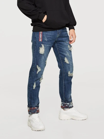 men tape detail rolled hem destroyed jeans