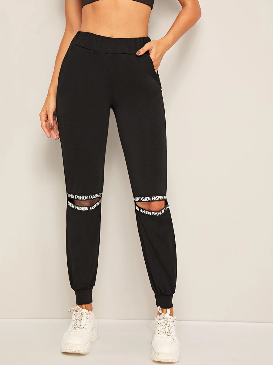 Pantalones deportivos con abertura con cinta con letra - Negro - Ver 1
