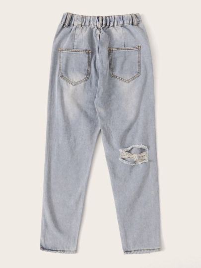 Jeans rotos bajo crudo con lavado descolorido
