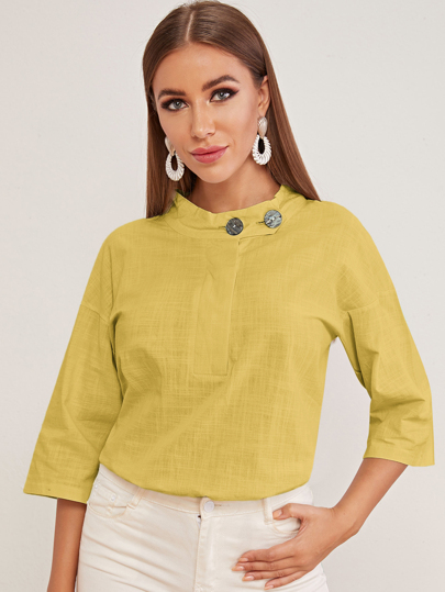 Blouse unicolore avec boutons