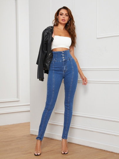 Jeans ajustados de cintura con banda ancha