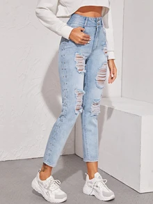 Jeans con diseño de tachuela con abertura con labado ligero