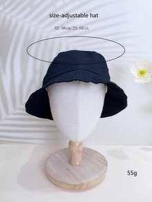 A Black Color Unisex Middle-Child Children Bucket Hat, Suitable For All Seasons, Made Of Lightweight All-Season Fabric Material. The Hat Is A Wide-Brimmed Summer Sun Ion Children Bucket Hat That Can Also Be Worn In Other Seasons.