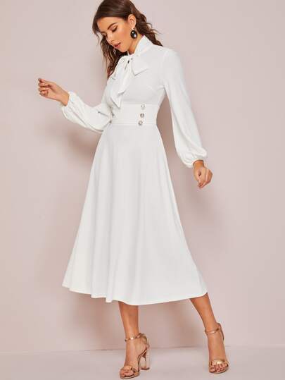 Robe avec nœud et manches bouffantes