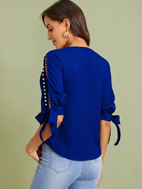 sweater with pearl bead cuffs