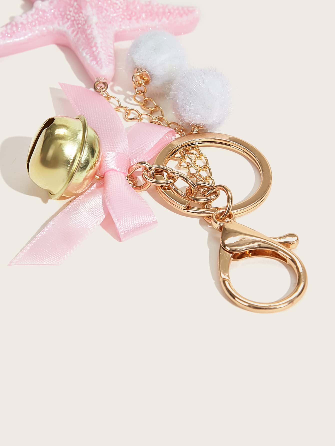 starfish shaped bag accessory with bell