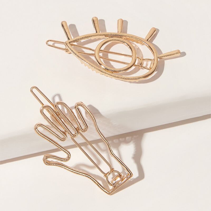 

2pcs Metallic Eye & Hand Hair Clip, Gold