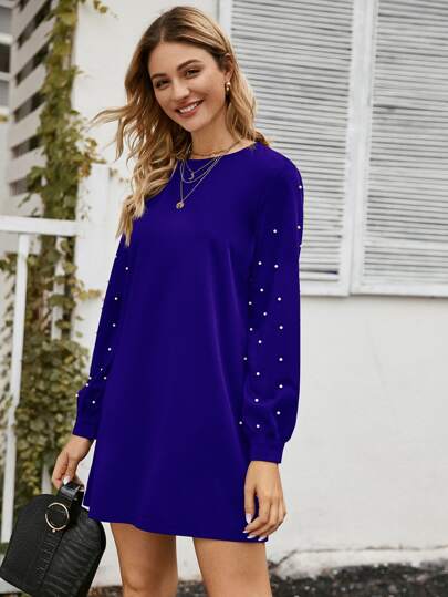 Robe tunique unicolore à perles