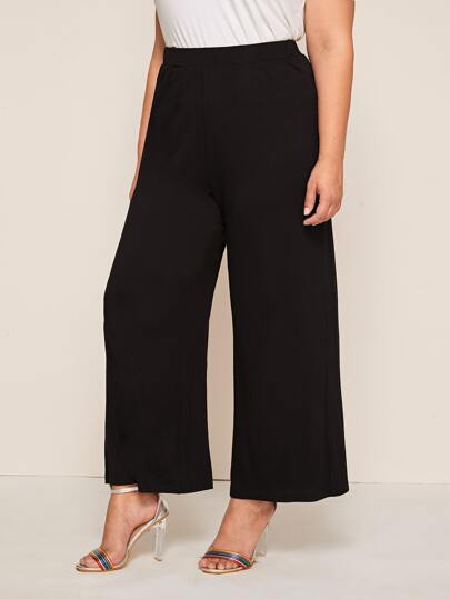 سروال بلون موحد مقاس كبير وبساق عريض