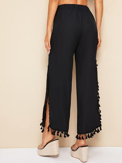 Pantalones anchos bajo con abertura ribete con fleco