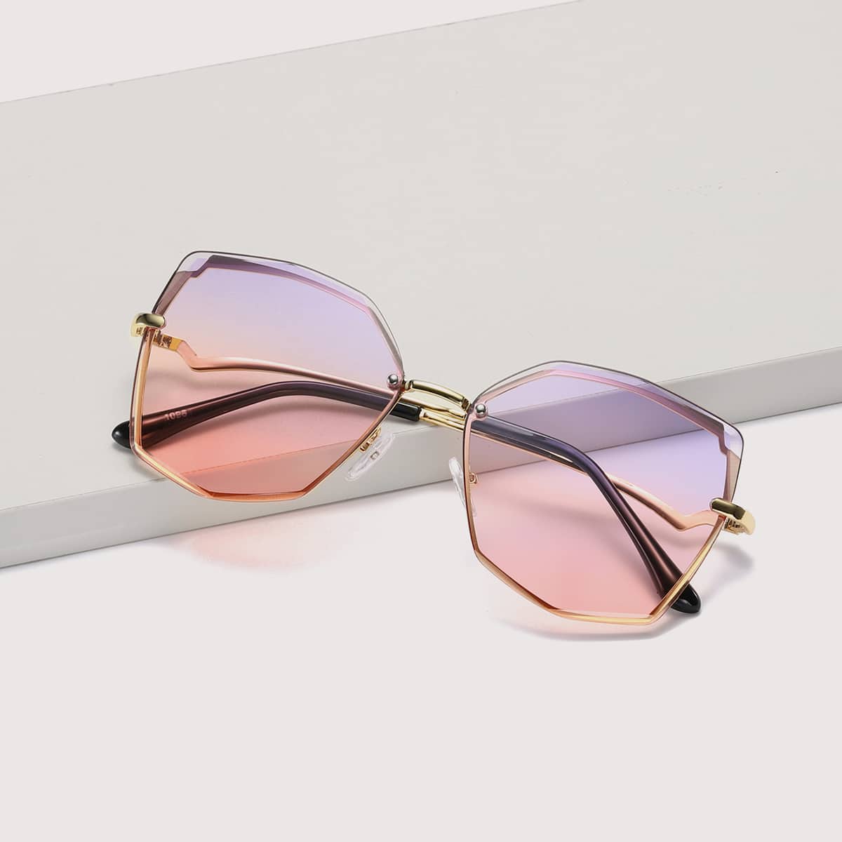 

Geometric Shaped Rimless Sunglasses With Case, Multicolor