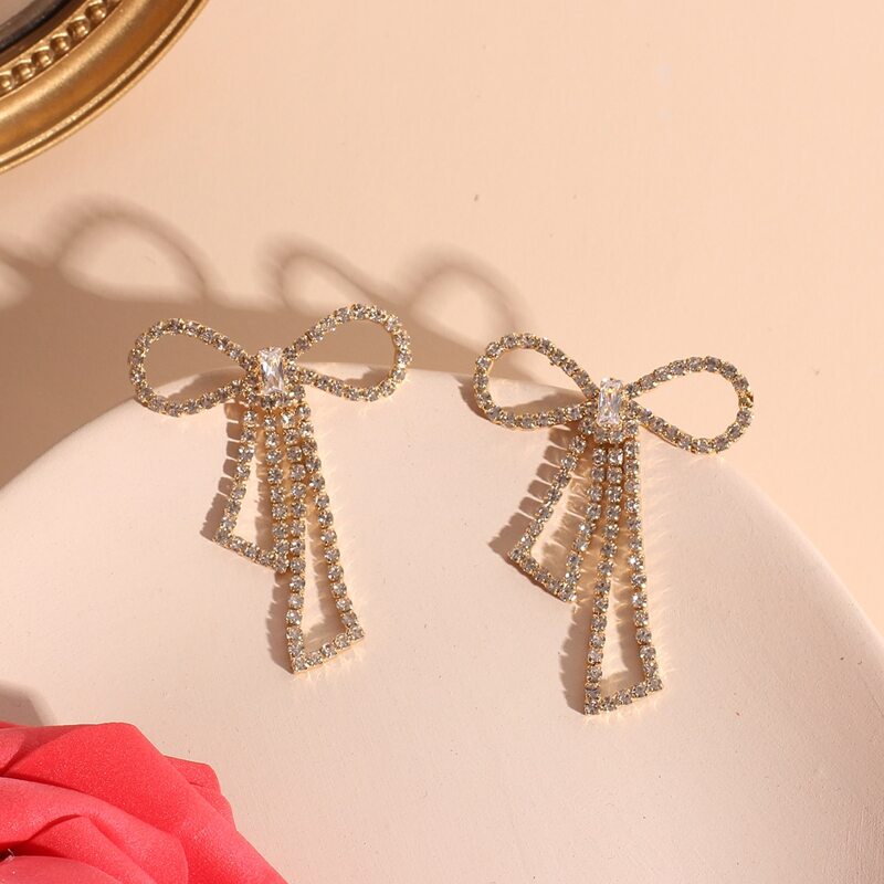 

Rhinestone Bow Earrings, Gold