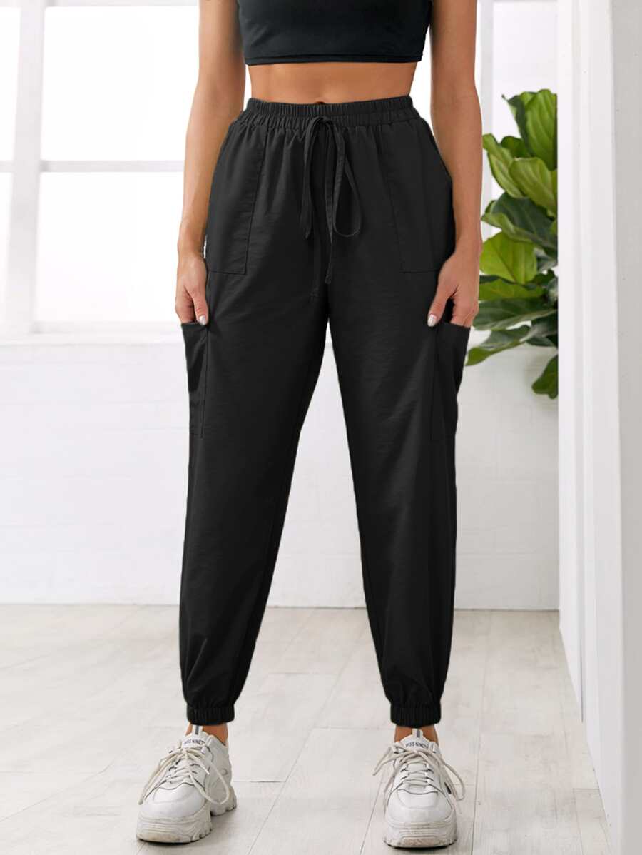 Pantalones deportivos con bolsillo con nudo unicolor - Negro - Ver 1