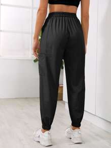 Pantalones deportivos con bolsillo con nudo unicolor - Negro - Ver 2