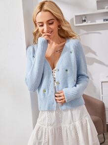 blue cardigan with flowers