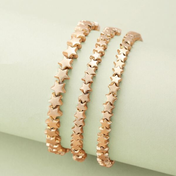 

Set Of Three Stretchy Star Detail Bracelets, Gold