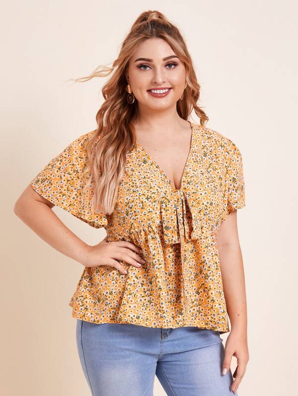 Camisa peplum floral de margarita con cordón delantero Camisa peplum con cordón delantero floral de margarita