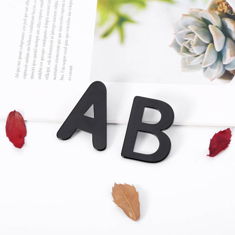 

Letter Shaped Stud Earrings, Black