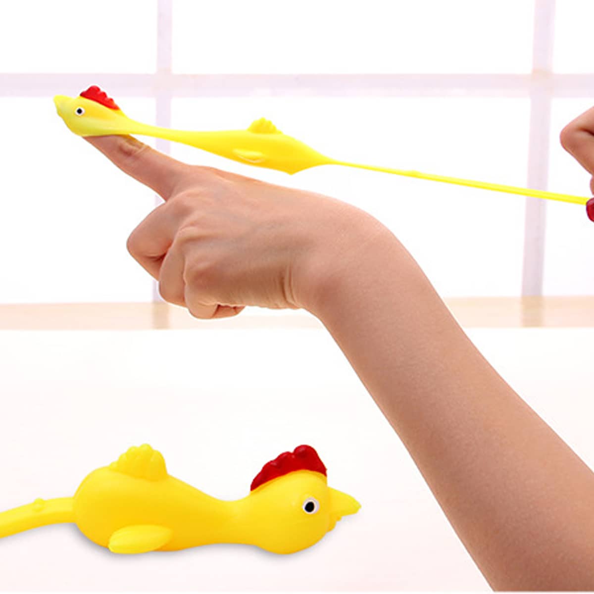 

1pc Stretch Chicken Finger Slingshot Toy, Yellow