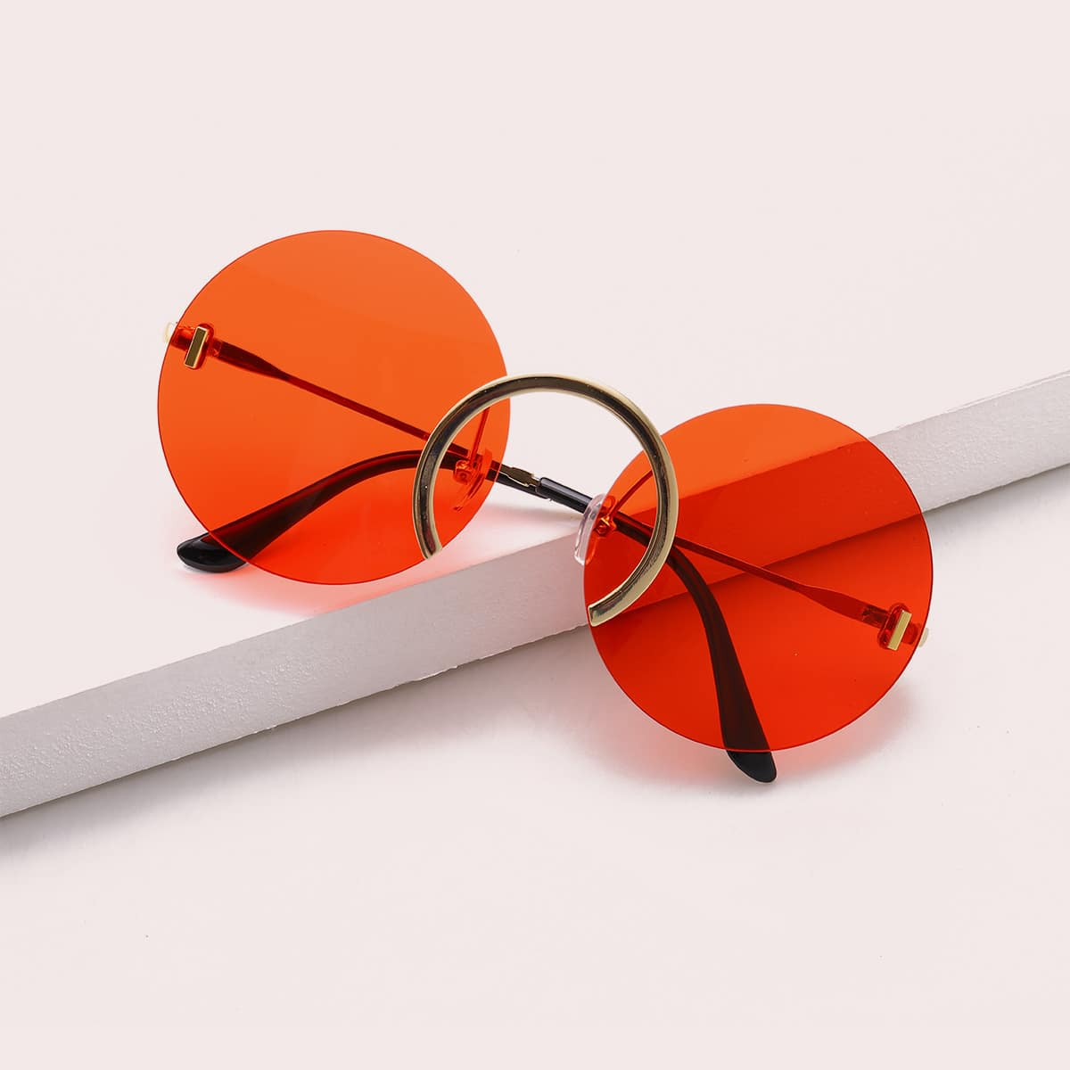 

Guys Tinted Lens Round Rimless Sunglasses