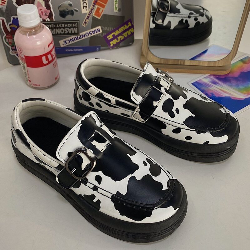 

Cow Print Buckle Slip On Flats, Black and white