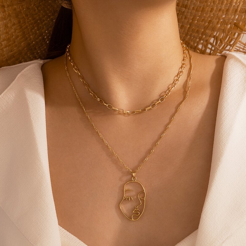 

Abstract Face Pendant Necklace, Gold