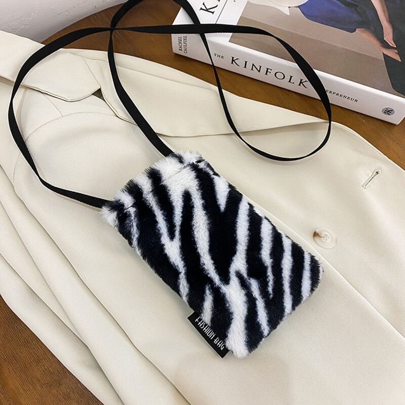 

Zebra Striped Fluffy Crossbody Phone Bag, Black and white