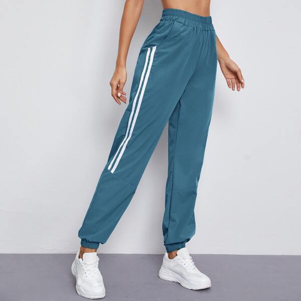 

Side Striped Slant Pocket Sports Pants, Teal blue