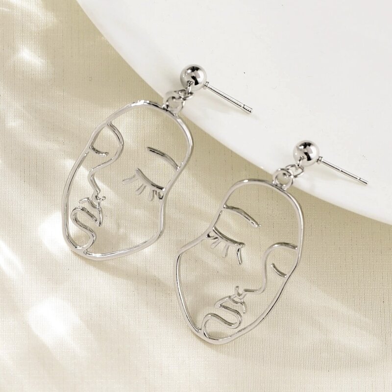 

Abstract Face Drop Earrings, Silver