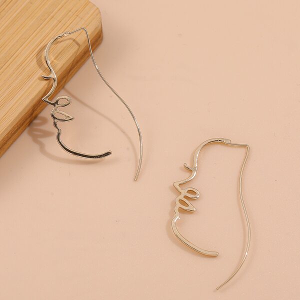 

Figure Design Earrings, Gold