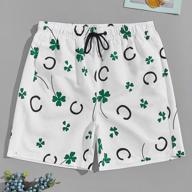 

Guys Leaf And Letter Graphic Swim Trunks, Multicolor