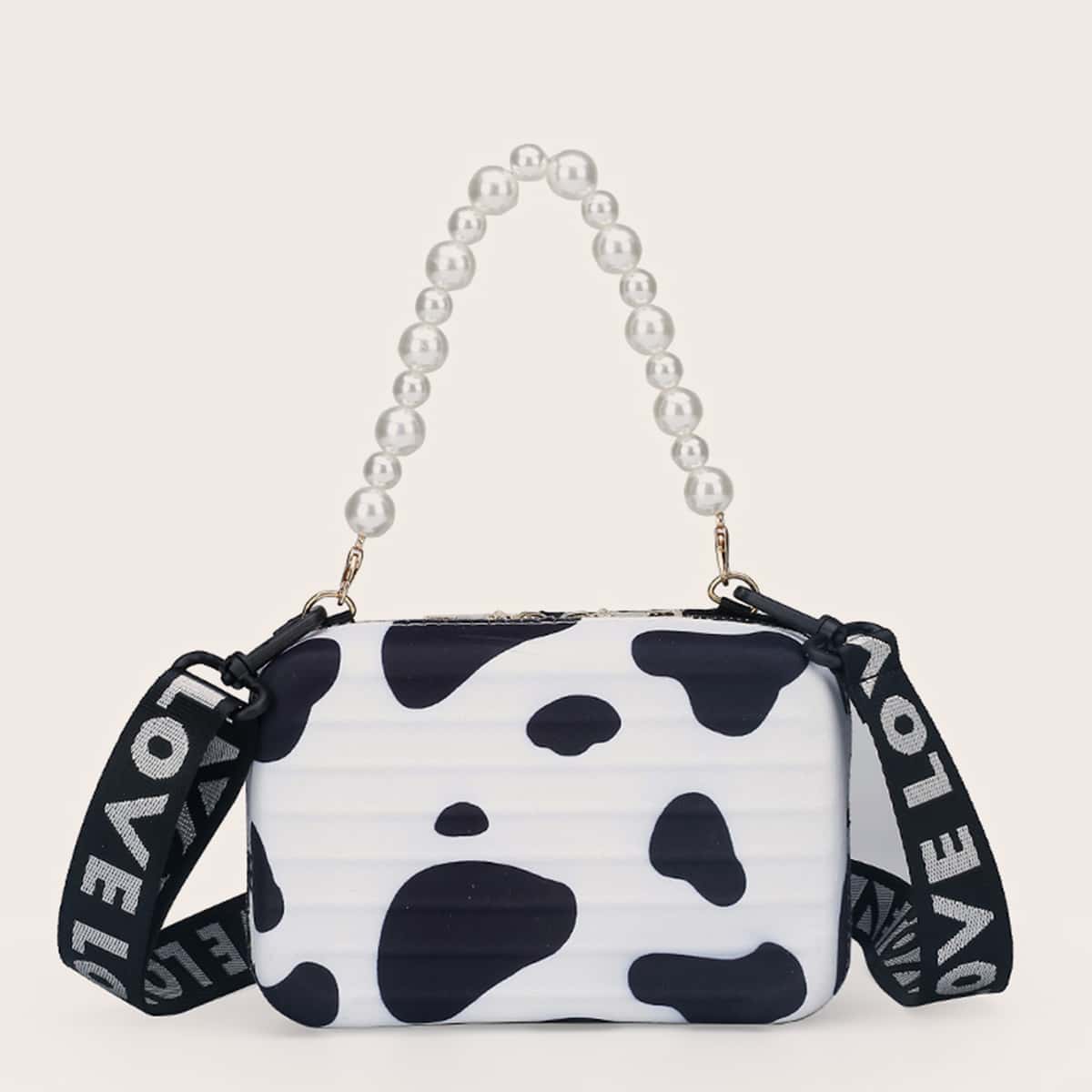 

Cow Print Suitcase Shaped Satchel Bag, Black and white