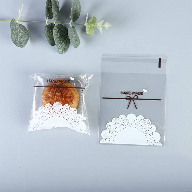 

100pcs Lace Pattern Packaging Bag, Clear
